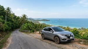 SUV rental Koh Samui on a hillside road with sea view